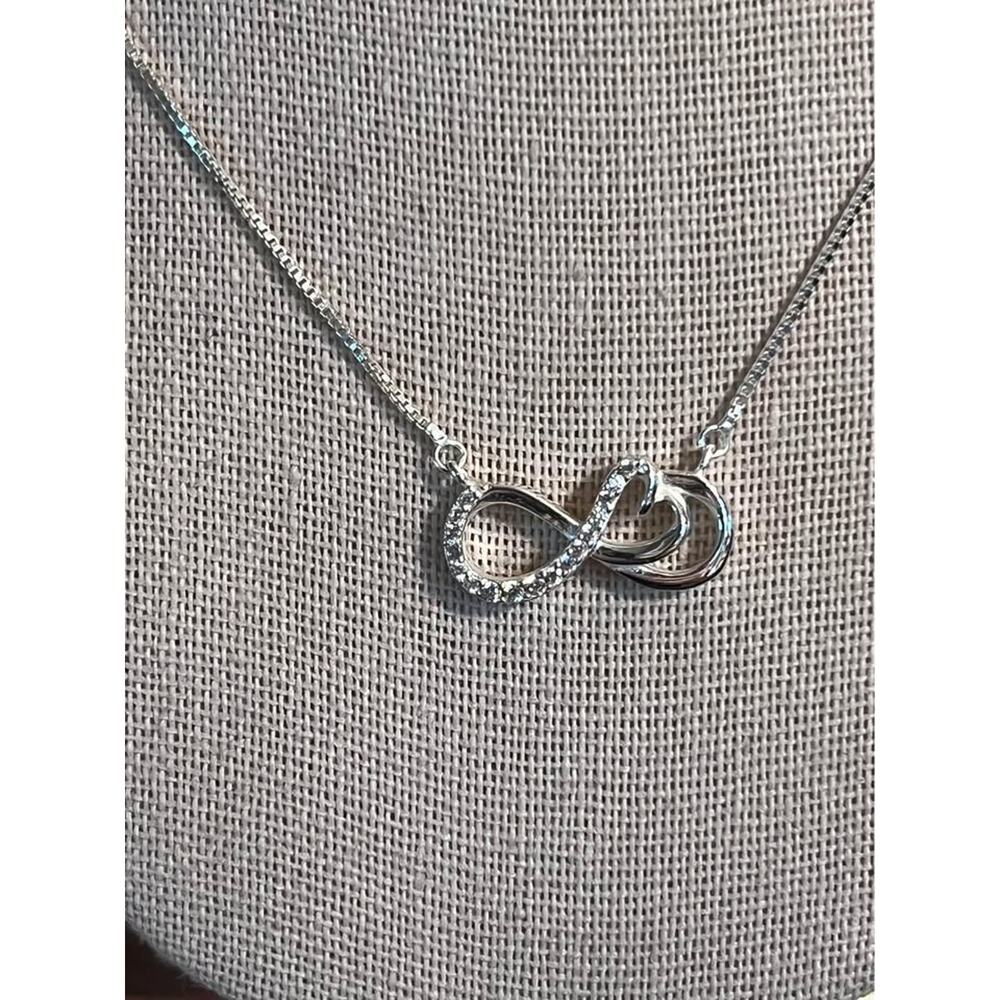 Beautiful Sterling infinity pendant. CZ. 16 inch length.